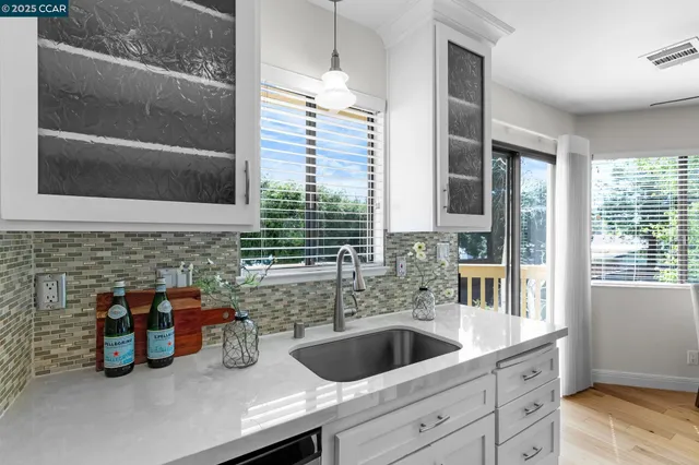 a front view of a house with car parked