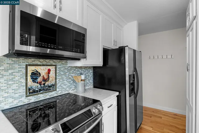 a view of a backyard with a garden and entertaining space