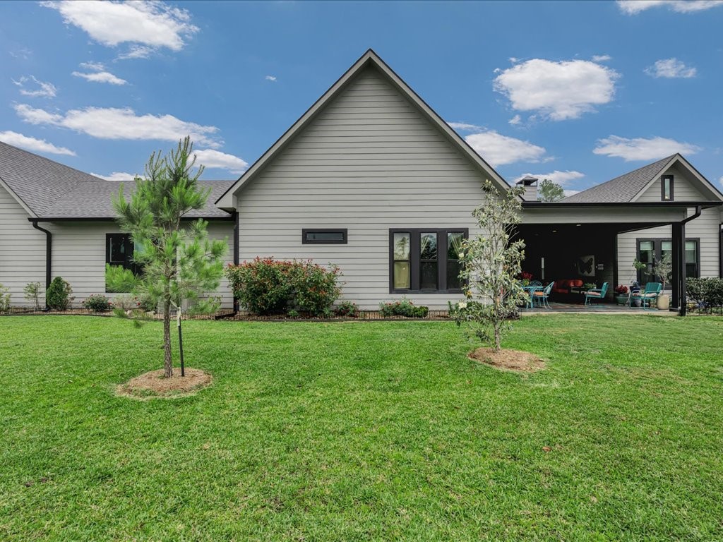 104 Wheeler Road Lufkin, TX 75901 - Photo 26 of 45 a house that is sitting in the grass