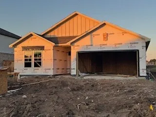 a view of house with backyard