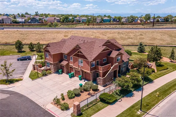 an aerial view of a house with a lake view