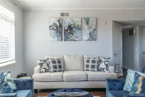 a living room with furniture and a large window