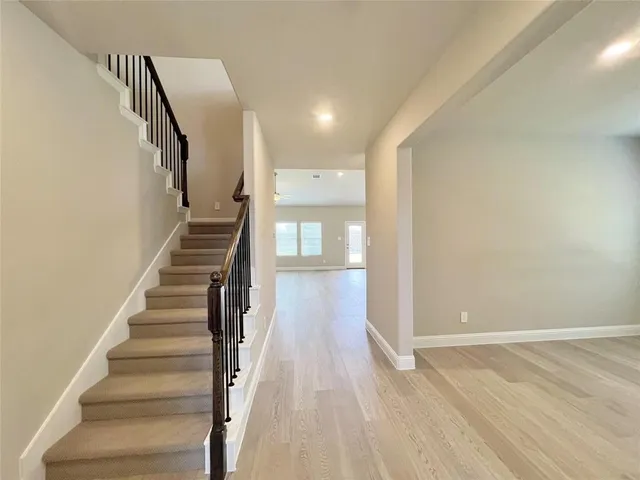 a view of entryway with wooden floor