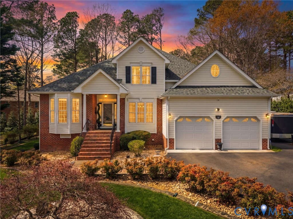 14012 Lippingham Terrace Chester, VA 23831 - Photo 1 of 50 a front view of a house with garden