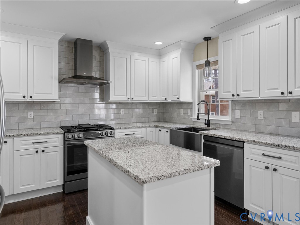14012 Lippingham Terrace Chester, VA 23831 - Photo 16 of 50 a kitchen with granite countertop white cabinets and stainless steel appliances