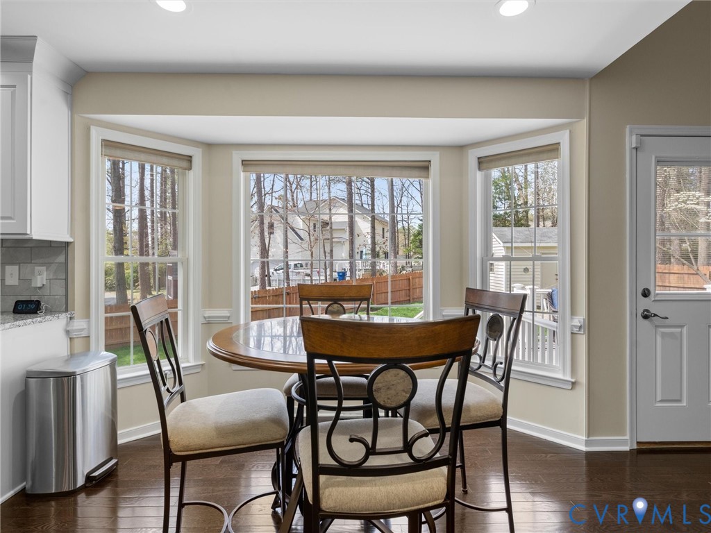 14012 Lippingham Terrace Chester, VA 23831 - Photo 18 of 50 a view of a dining room with furniture window and wooden floor
