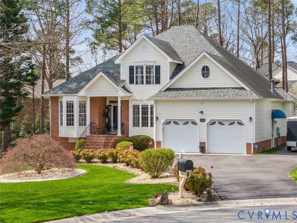 14012 Lippingham Terrace Chester, VA 23831 - Photo 2 of 50 a front view of a house with a yard