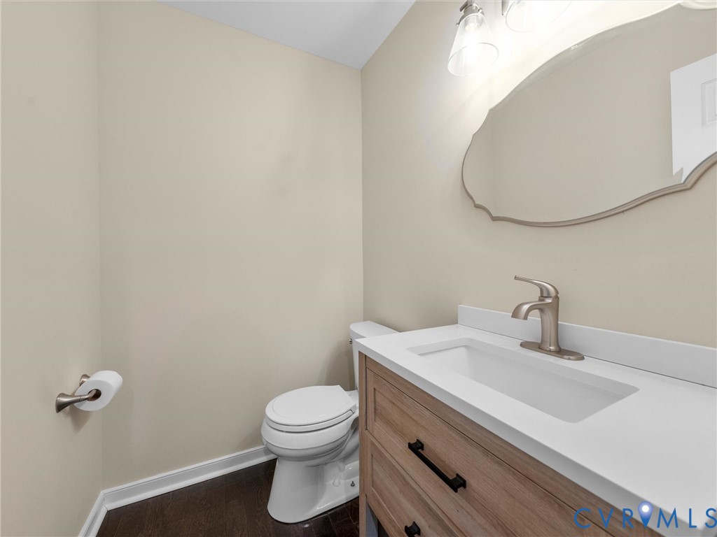 14012 Lippingham Terrace Chester, VA 23831 - Photo 23 of 50 a bathroom with a sink mirror and toilet