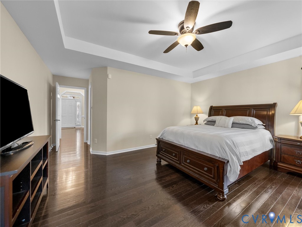 14012 Lippingham Terrace Chester, VA 23831 - Photo 24 of 50 a spacious bedroom with a bed and a flat screen tv