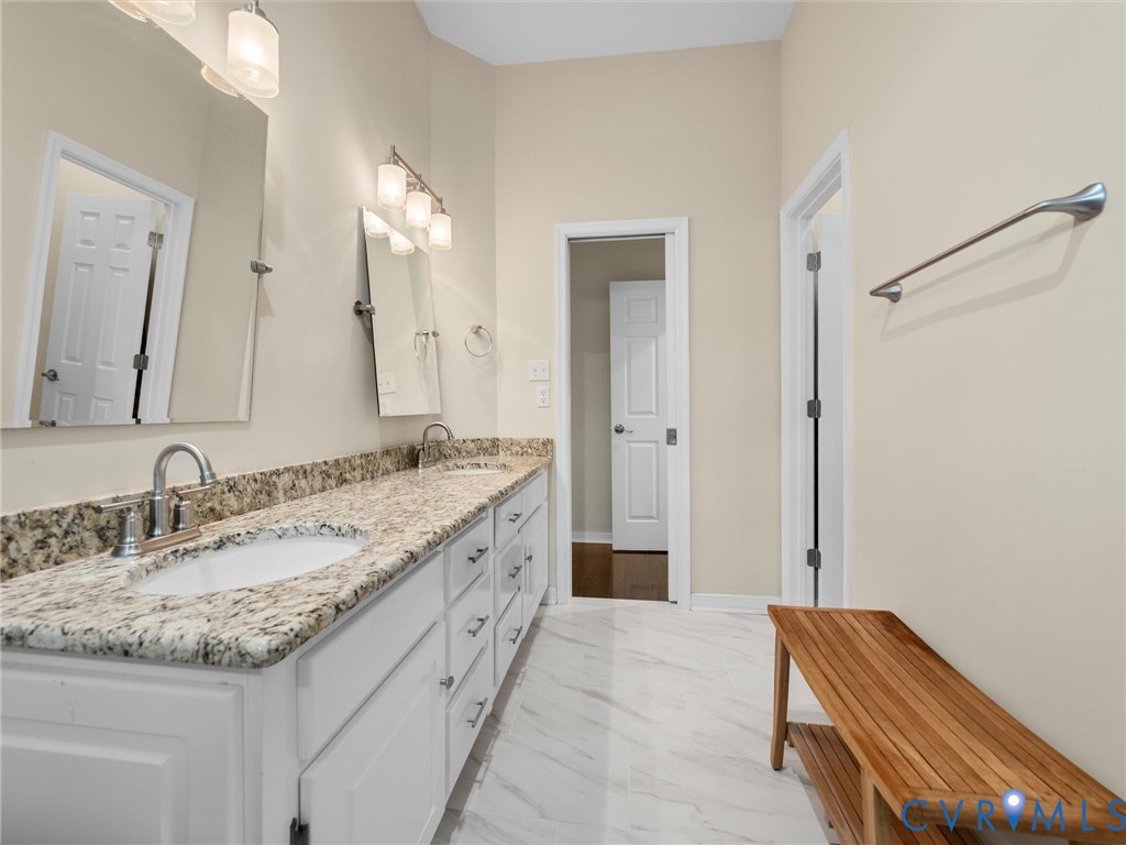14012 Lippingham Terrace Chester, VA 23831 - Photo 28 of 50 a bathroom with a granite countertop sink and a mirror