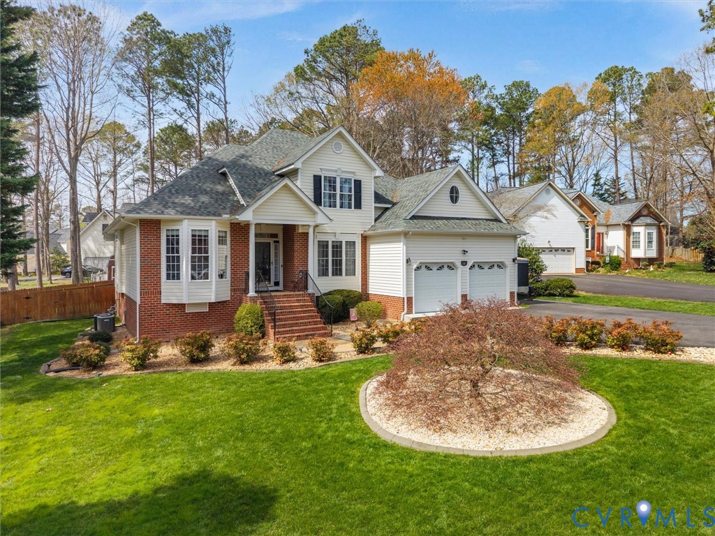14012 Lippingham Terrace Chester, VA 23831 - Photo 3 of 50 a front view of a house with garden