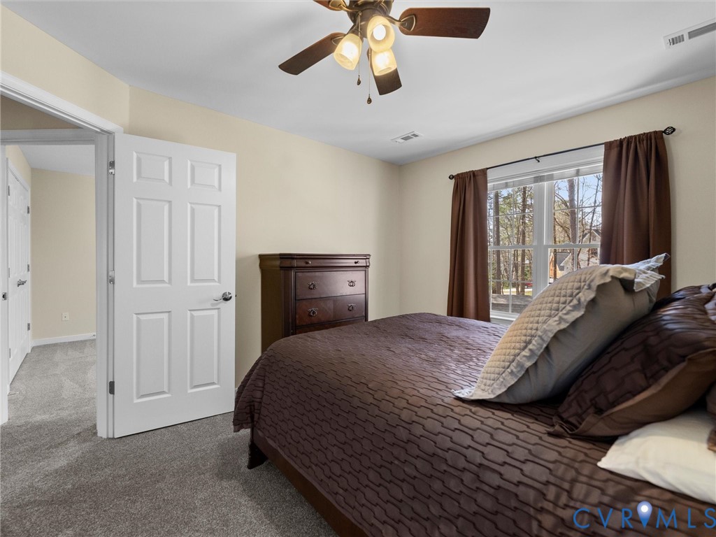 14012 Lippingham Terrace Chester, VA 23831 - Photo 32 of 50 a bedroom with a bed and window