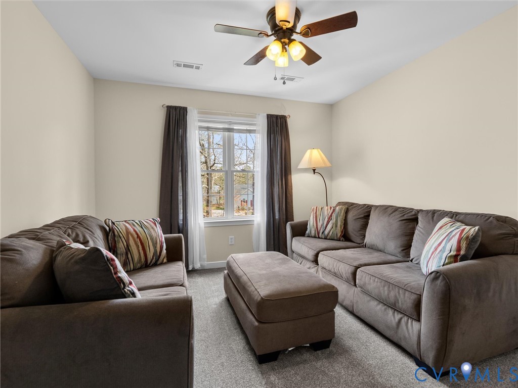 14012 Lippingham Terrace Chester, VA 23831 - Photo 34 of 50 a living room with furniture and a window