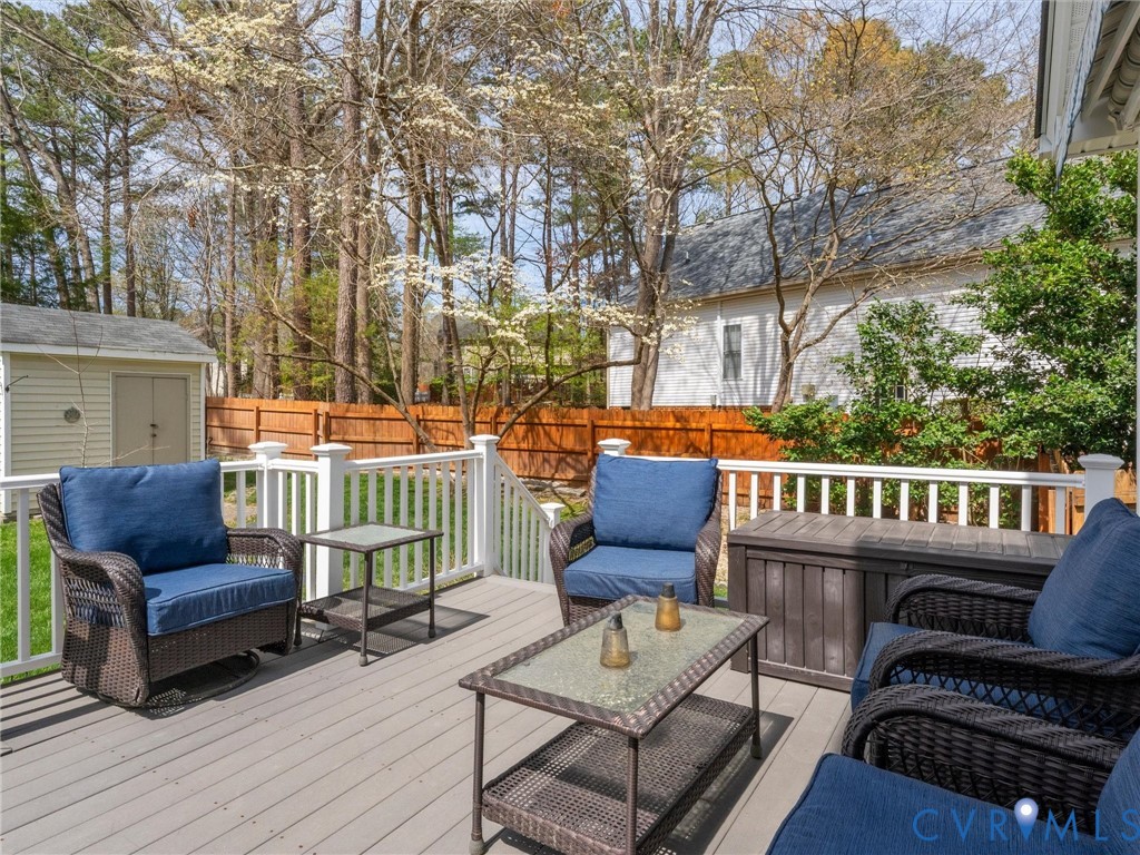 14012 Lippingham Terrace Chester, VA 23831 - Photo 40 of 50 a view of a chairs and tables in the back yard of the house