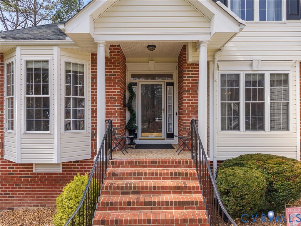14012 Lippingham Terrace Chester, VA 23831 - Photo 4 of 50 a front view of a house with a porch
