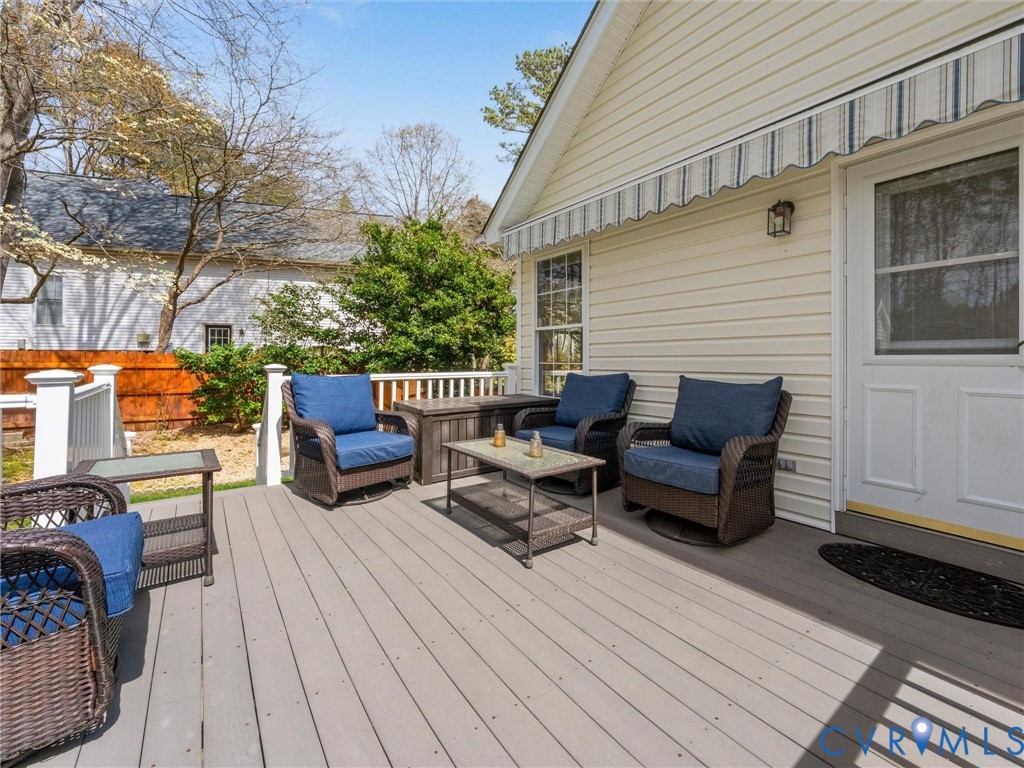 14012 Lippingham Terrace Chester, VA 23831 - Photo 41 of 50 a view of a patio with a table and chairs and wooden floor