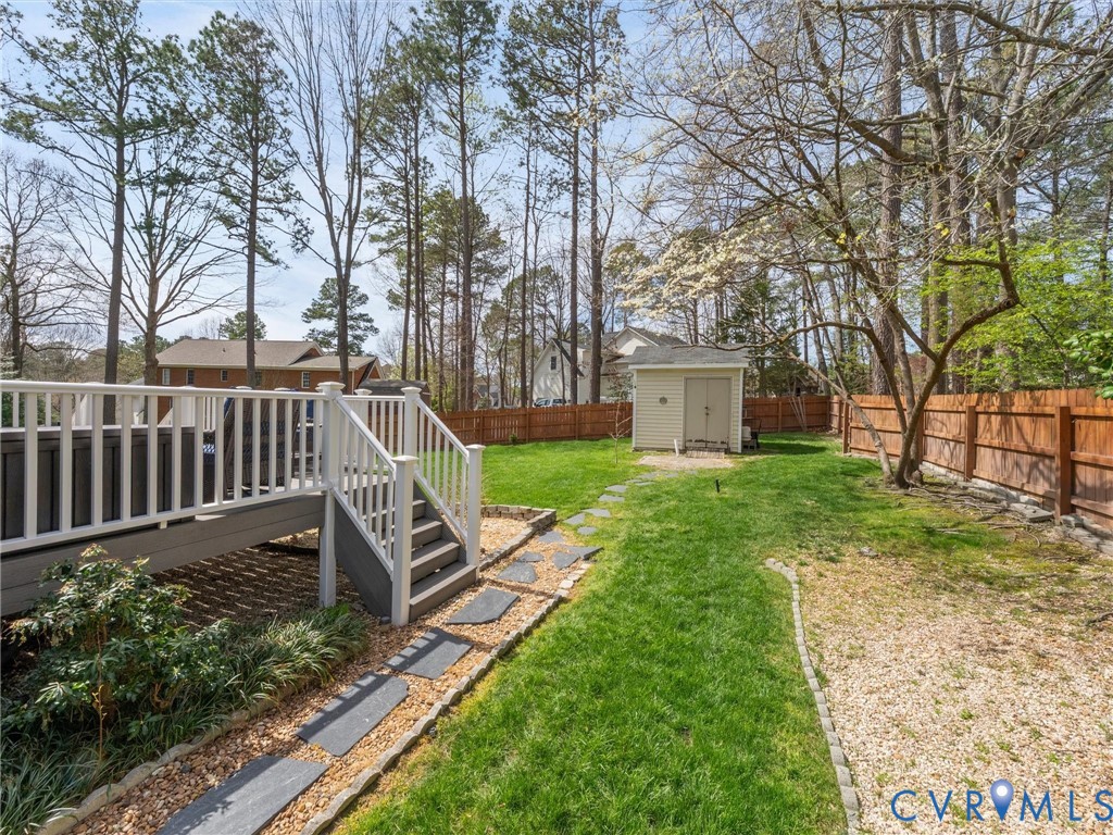 14012 Lippingham Terrace Chester, VA 23831 - Photo 44 of 50 a view of a bench in a backyard with wooden fence