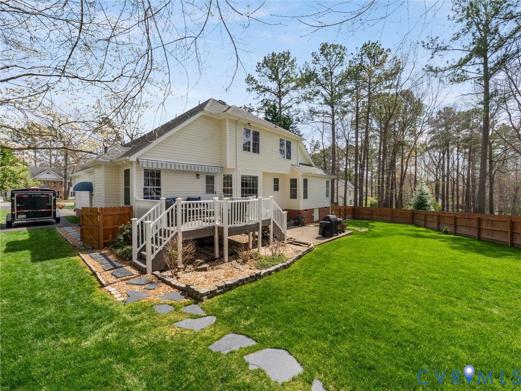 14012 Lippingham Terrace Chester, VA 23831 - Photo 46 of 50 a front view of a house with a yard table and chairs
