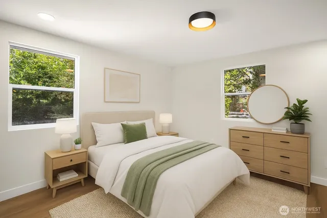 a bed room with a bed and a window