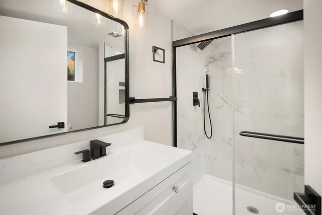 a bathroom with a sink and a shower