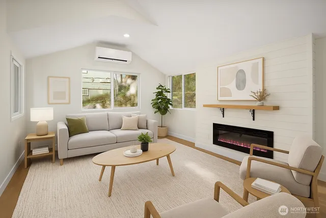 a living room with furniture and a potted plant