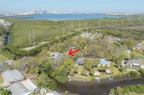 an aerial view of a house with a lake view