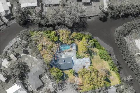 aerial view of a house with a yard