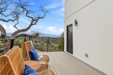 a view of a table and chairs in the patio