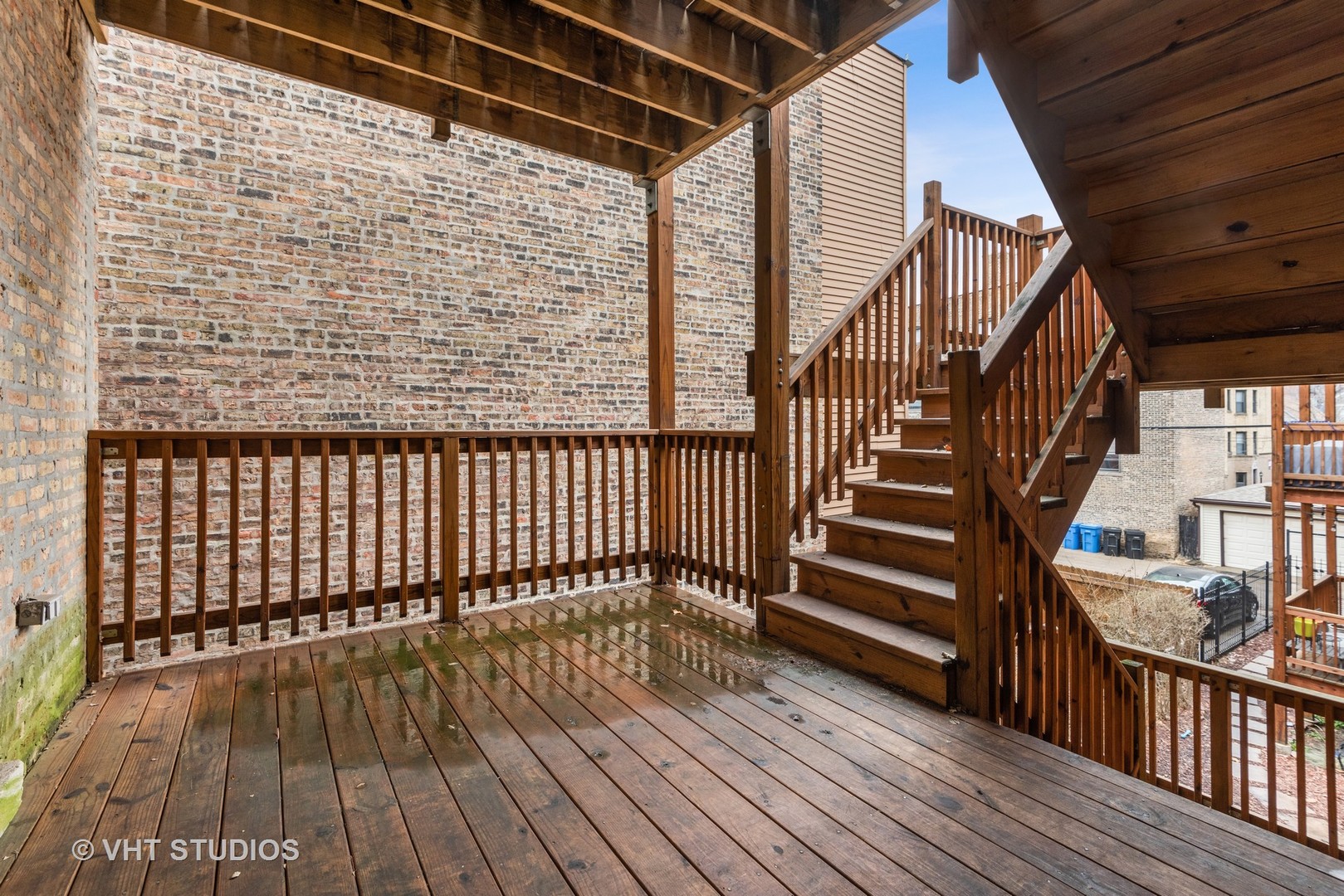 1902 West Byron Street, Unit 2 Chicago, IL 60613 - Photo 16 of 17 a view of balcony with wooden floor