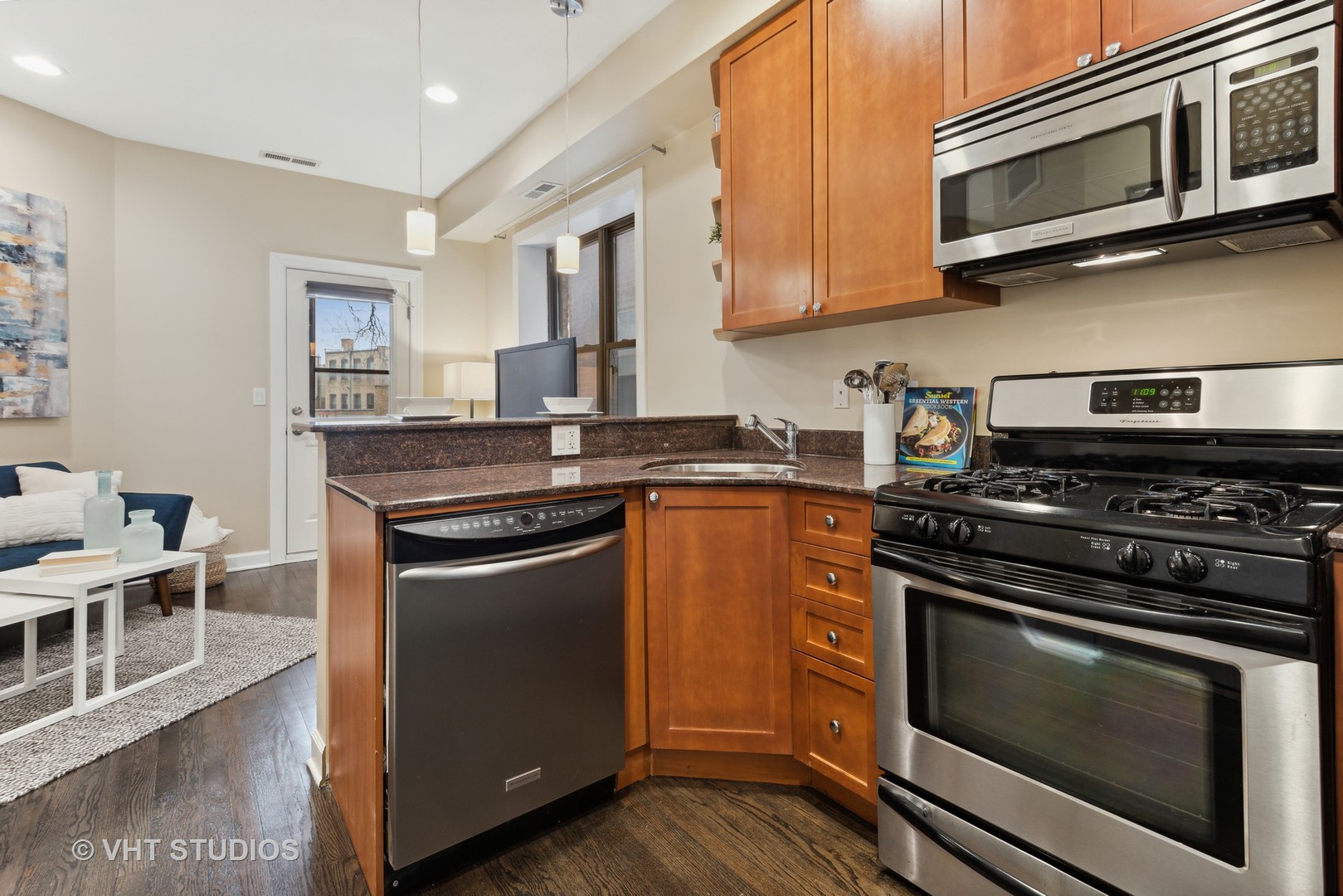 1902 West Byron Street, Unit 2 Chicago, IL 60613 - Photo 8 of 17 a kitchen with stainless steel appliances a stove microwave and sink