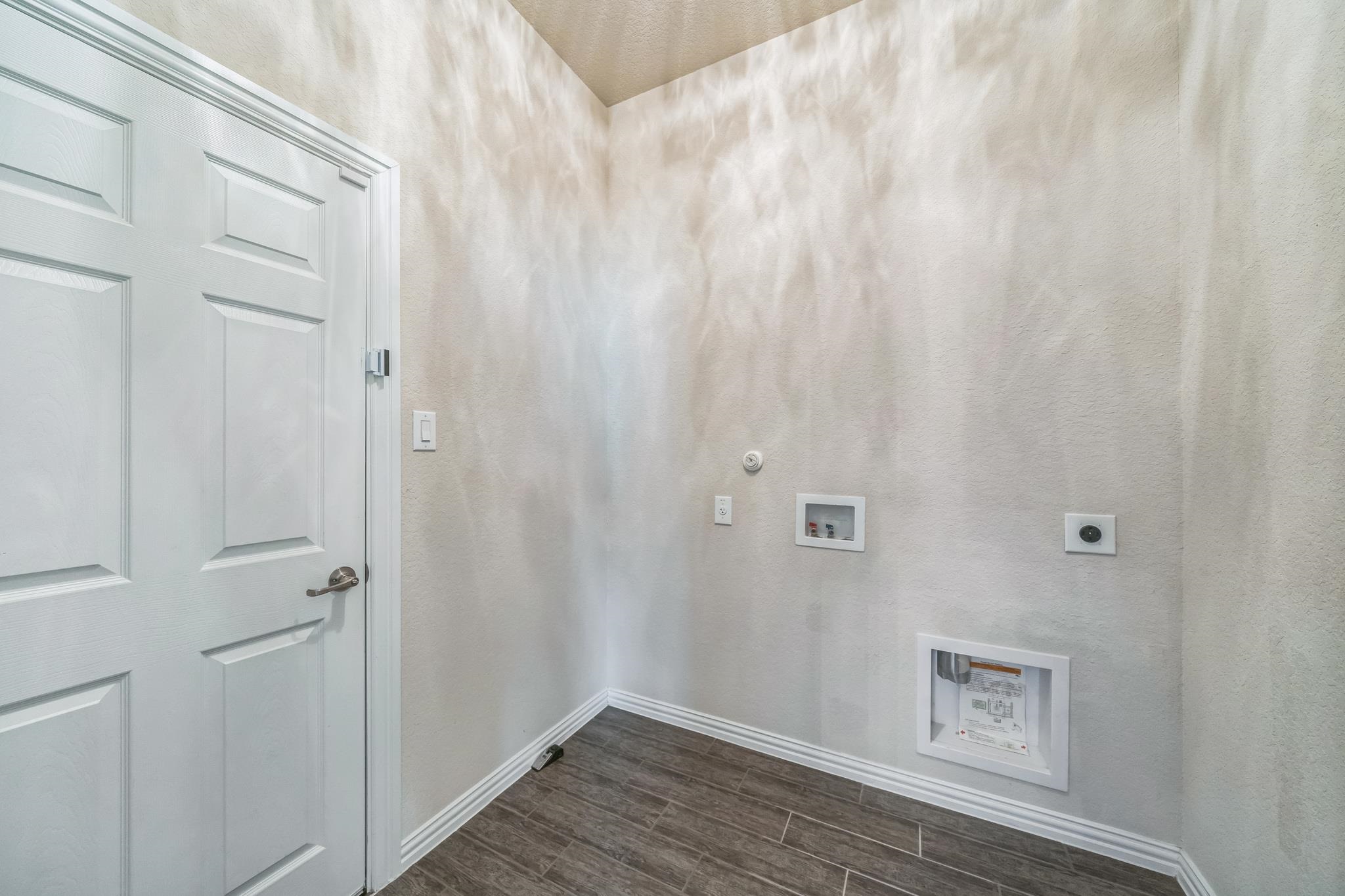 12009 Vignette Schertz, TX 78154 - Photo 14 of 40 a view of a hallway with wooden floor