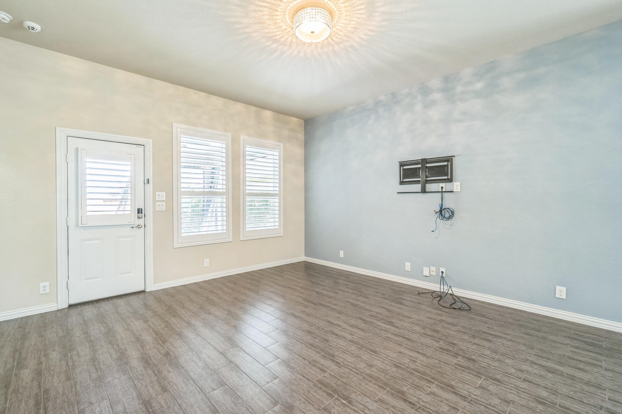 12009 Vignette Schertz, TX 78154 - Photo 17 of 40 an empty room with wooden floor and windows