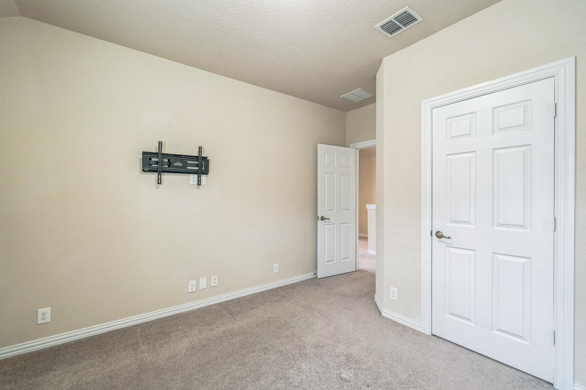 12009 Vignette Schertz, TX 78154 - Photo 21 of 40 an empty room with a door