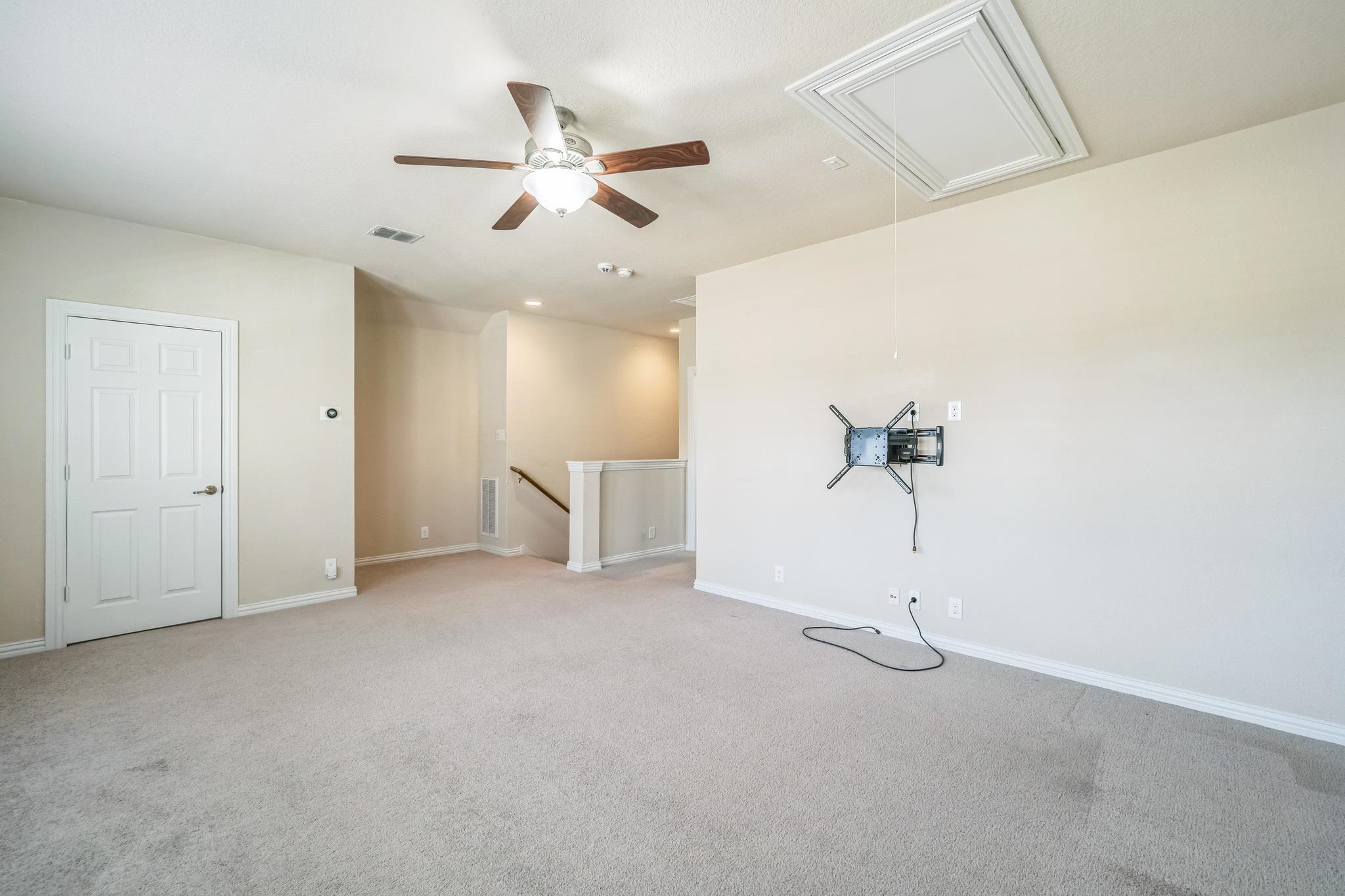 12009 Vignette Schertz, TX 78154 - Photo 29 of 40 an empty room with a ceiling fan and window