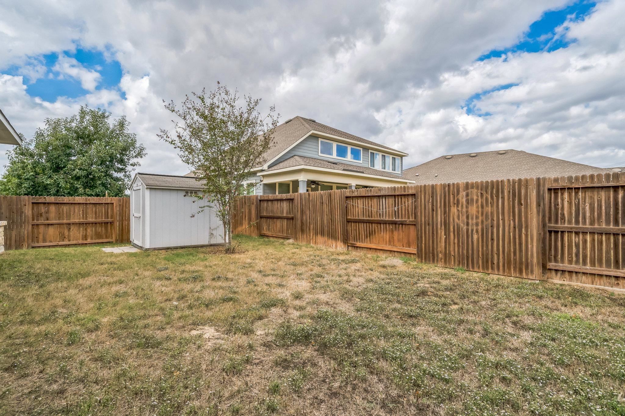 12009 Vignette Schertz, TX 78154 - Photo 35 of 40 a front view of a house with a yard and garage