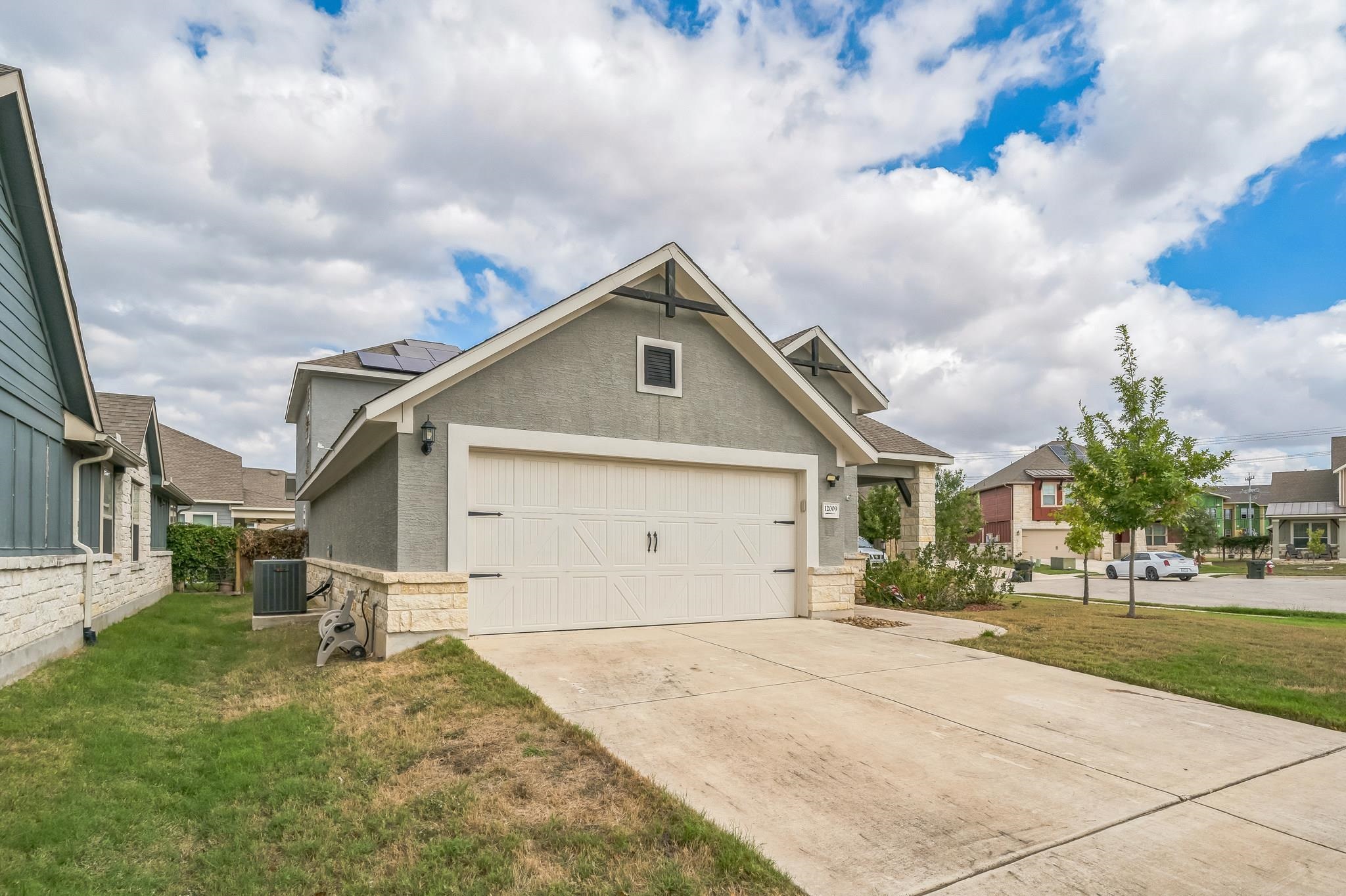 12009 Vignette Schertz, TX 78154 - Photo 4 of 40 a house with yard in front of it
