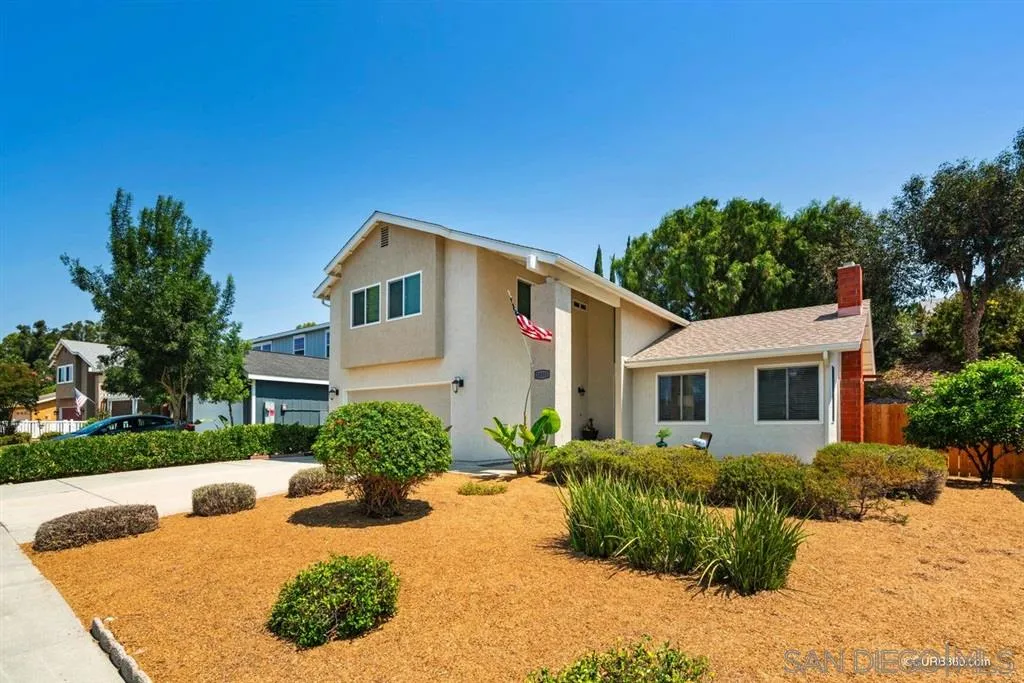 10351 Cadwell Road Santee, CA 92071 - Photo 1 of 25 a front view of a house with a yard