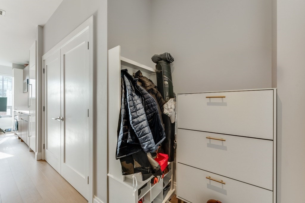 100 Shawmut, Unit 411 Boston, MA 02118 - Photo 9 of 15 a view of walk in closet with clothes and shoes