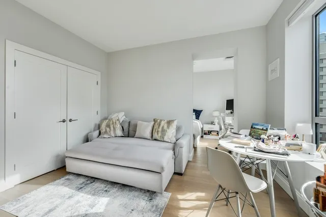 a living room with furniture and a table