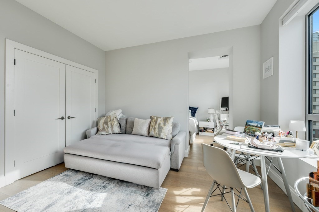 100 Shawmut, Unit 411 Boston, MA 02118 - Photo 10 of 15 a living room with furniture and a table
