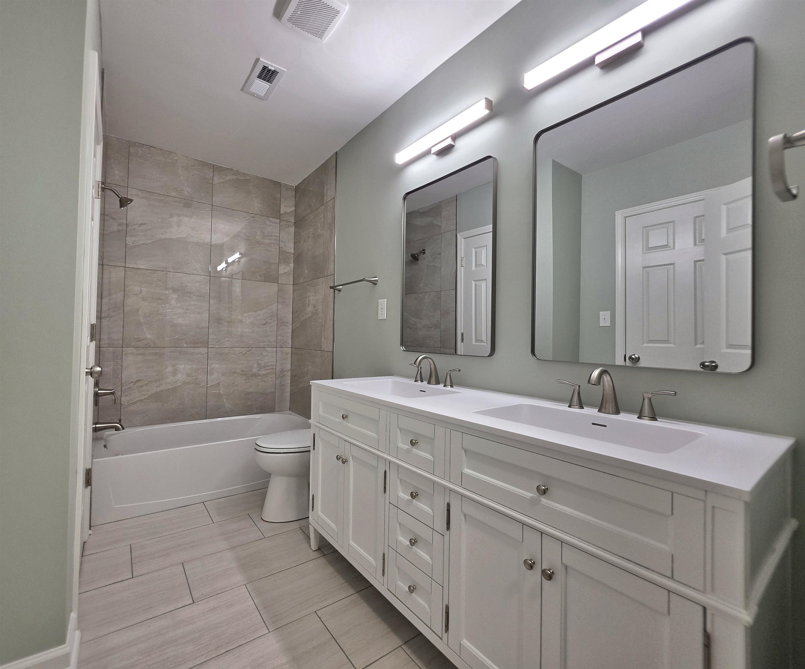 7966 Martha Road Millington, TN 38053 - Photo 15 of 26 Dual vanity featuring white shaker cabinetry, integrated sinks, and brushed nickel fixtures