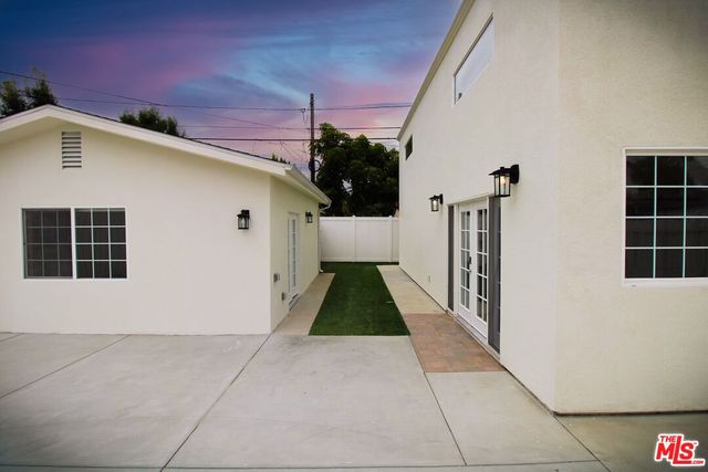 a view of front door of a house with a yard