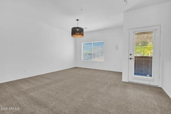 a kitchen with stainless steel appliances granite countertop a refrigerator stove and sink