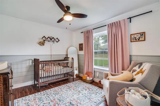 a bedroom with furniture and a window