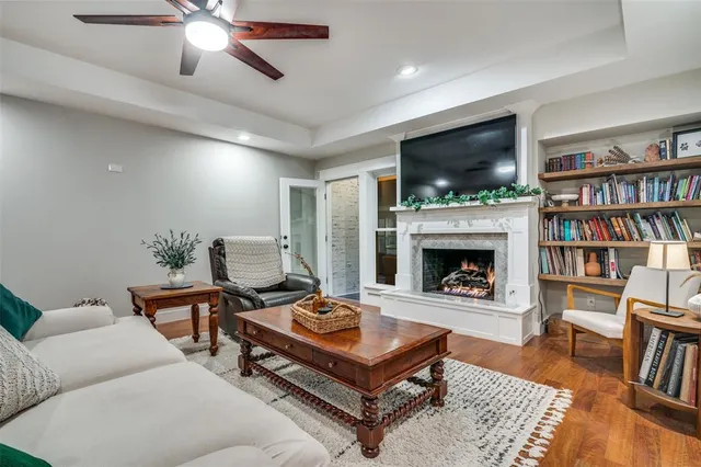 a living room with furniture and a fireplace
