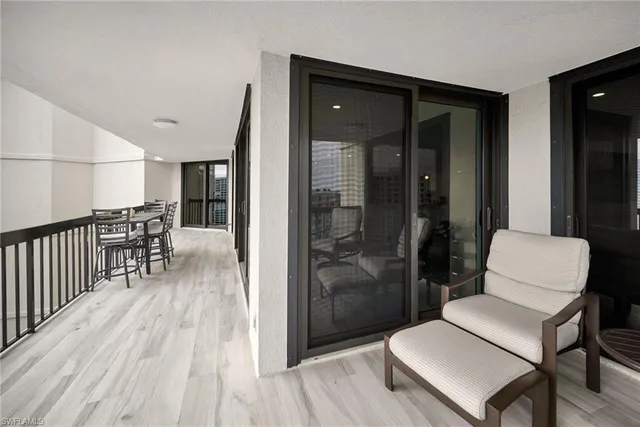 a bathroom with a toilet a mirror and a shower