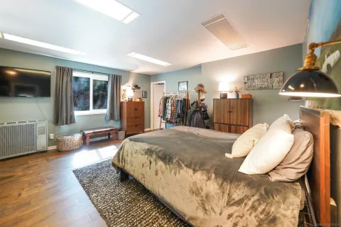 a bed room with a bed and a couch