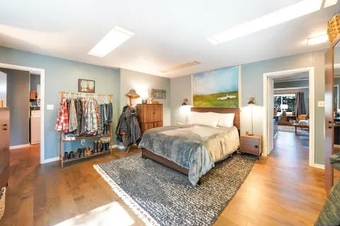 a bed room with a bed and a walk in closet