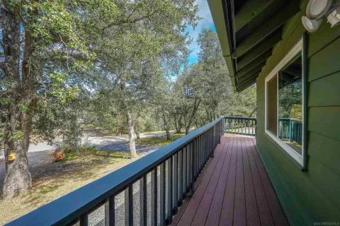 a view of a balcony with wooden floor