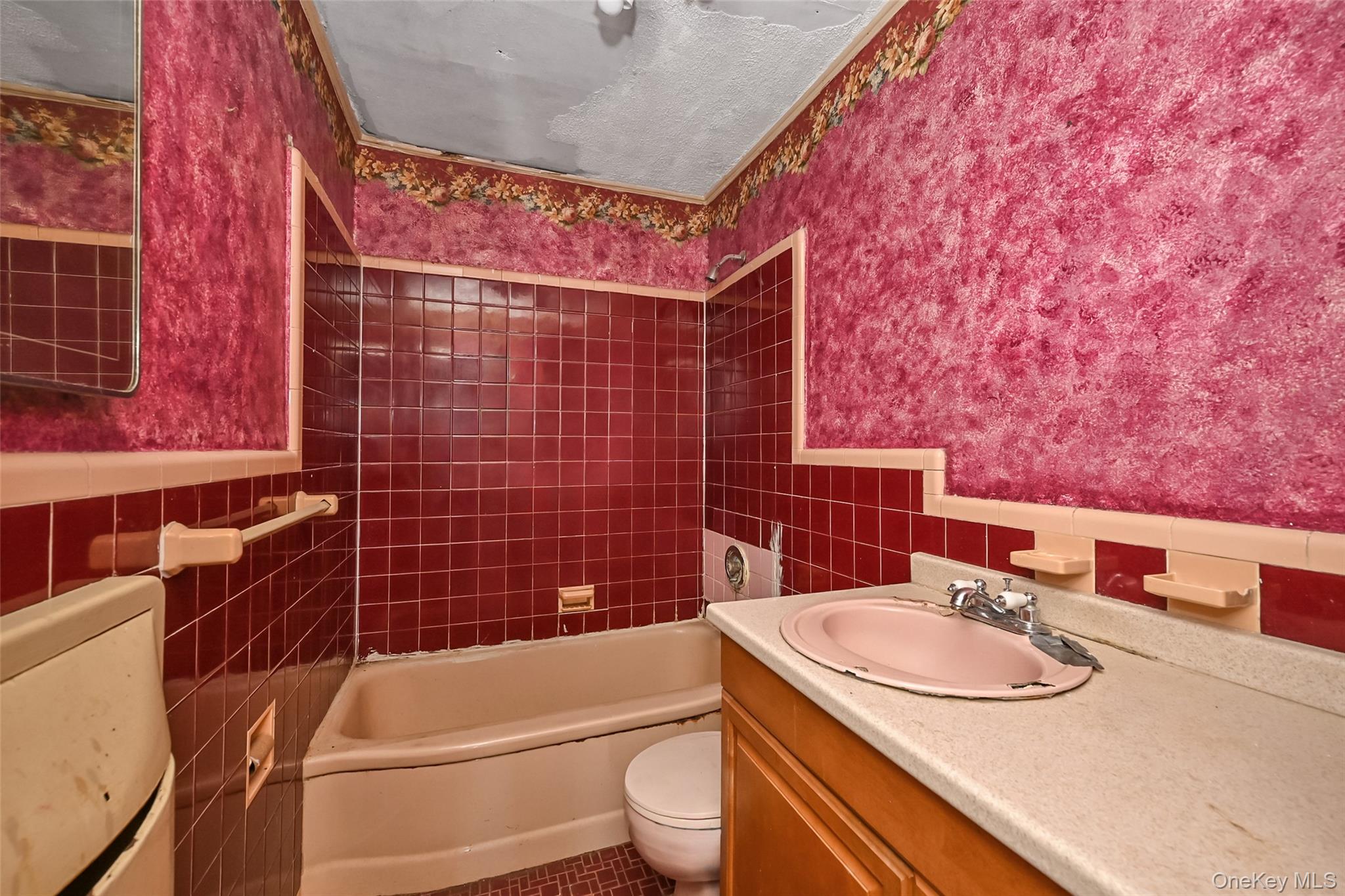 2255 Parkhurst Road Elmont, NY 11003 - Photo 15 of 24 a bathroom with a sink toilet and shower